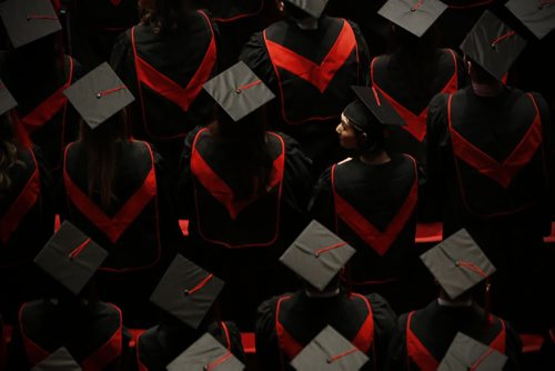 JOHN WOODS / WINNIPEG FREE PRESS A graduate sneaks a peak at the crowd during the Red River College spring convocation ceremony at the Centennial Concert Hall Tuesday, June 7, 2016.