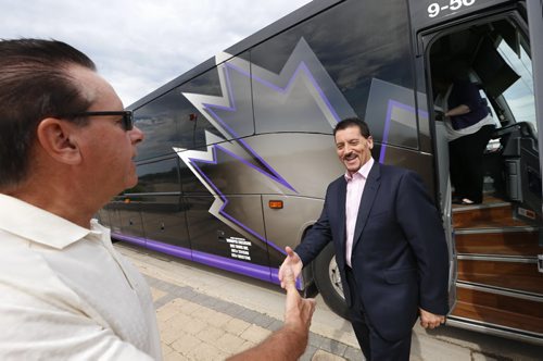 WAYNE GLOWACKI / WINNIPEG FREE PRESS     At left, Selkirk Mayor Larry Johannson welcomes Walt Morris, pres./owner of Walt Morris Group of Companies as he steps out of one of his buses to attend a news conference in Selkirk.Mb. to announce Thursday the Headingley-based Exclusive Bus Lines is taking over the Selkirk-to-Winnipeg bus service, that Beaver Bus Lines is halting July 1. Bill Redekop story. June 9  2016