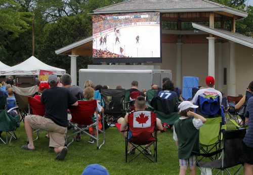 BORIS MINKEVICH / WINNIPEG FREE PRESS Winkler, MB - HOCKEY NIGHT IN WINKLER - Pittsburgh Penguin Eric Fehr has a hometown Stanley Cup party in Bethel Heritage Park. They watch the game on the big screen.  June 9, 2016.