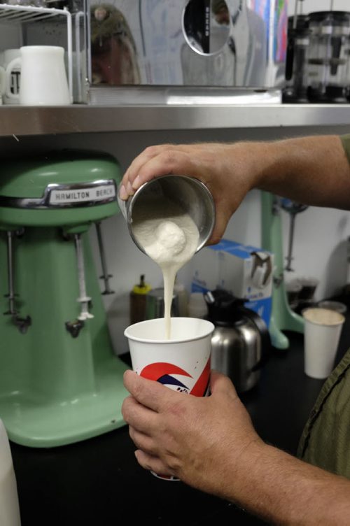 ZACHARY PRONG / WINNIPEG FREE PRESS  "Cookie" Simon Daintree, an employee at Cafe 1958 on Westminster Ave., pouring a vanilla milkshake on June 9, 2016.