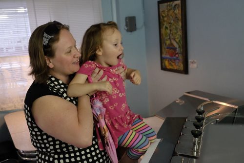 ZACHARY PRONG / WINNIPEG FREE PRESS  Hannah Robinson, 4, can't believe her eyes as her mother Meagan shows her the ice cream fridge at Cafe 1958 on June 9, 2016.