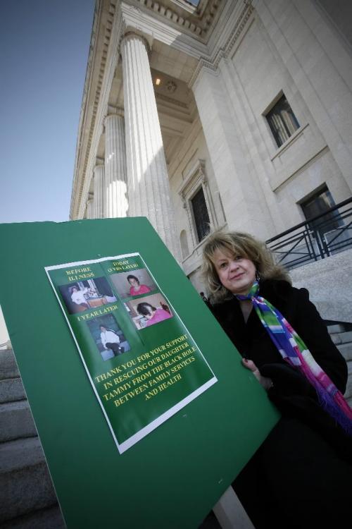 John Woods / Winnipeg Free Press / April 6, 2008 - 080406  - Tricia Kell sits on the steps of the Legislature after a press conference in Winnipeg Sunday April 6, 2008.  Kell says she is planning to sleep on the steps of the Manitoba Legislature unless something is done for her mentally ill daughter Tammy.  Kell says that she has been told that her daughter is beyond the system and her unique case falls between the services of the  Health and Family Services programs.