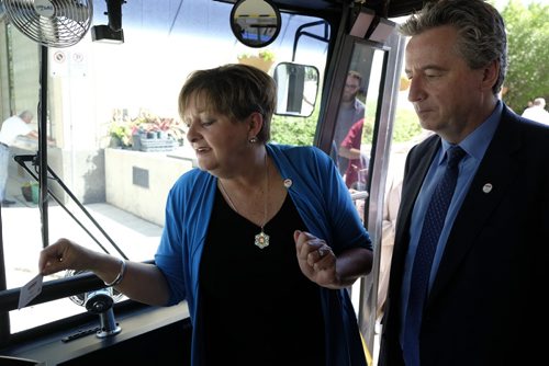 ZACHARY PRONG / WINNIPEG FREE PRESS  Councillor Janice Lukes and Director of Winnipeg Transit Dave Wardrop demonstrate the new electronic fare collection system 'peggo' at City Hall on Friday, June 10, 2016. "The new electronic fare collection system is simple and easy to use and will improve the transit experience for both riders and operators," said Lukes. 'peggo' cards can be purchased at any 7/11, Shoppers Drug Mart, online or over the phone.