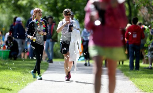 TREVOR HAGAN / WINNIPEG FREE PRESS Participants walk through bubbles at a checkpoint in Munson Park during the CancerCare Manitoba Challenge for Life 2.0, Saturday, June 11, 2016.