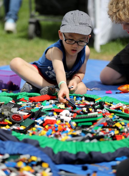 TREVOR HAGAN / WINNIPEG FREE PRESS Mason Huynh, 4, playing with Lego at Kids Fest at The Forks, Saturday, June 11, 2016.