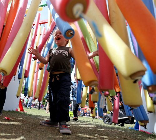 TREVOR HAGAN / WINNIPEG FREE PRESS Abel Gormaly, 2, makes his way through "Oodles of Noodles" at Kids Fest at The Forks, Saturday, June 11, 2016.