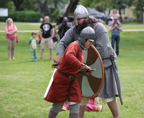 TREVOR HAGAN / WINNIPEG FREE PRESS Cathy Dyck, left, battles with Nathan Beal. The Sons of Lugh Viking Society is made up of around 25 members from across southern Manitoba, and were battling each other in Coronation Park, Saturday, June 11, 2016.