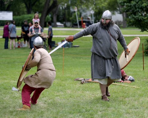 TREVOR HAGAN / WINNIPEG FREE PRESS Zachary Sigurdson, left, battles with Nathan Beal. The Sons of Lugh Viking Society is made up of around 25 members from across southern Manitoba, and were battling each other in Coronation Park, Saturday, June 11, 2016.