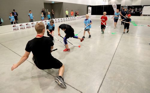 TREVOR HAGAN / WINNIPEG FREE PRESS Dayton Kiesman, 12, who plays defence for the St.Vital Victorias, trying a nifty between the legs shot during the Canadian Hockey Expo at the Convention Centre, Saturday, June 11, 2016.