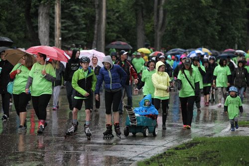 MIKE DEAL / WINNIPEG FREE PRESS  Despite the steady rain and a little thunder a few hundred dedicated people start the 10km RBC Cruisin Down the Crescent walkathon Sunday morning along Wellington Crescent. The fundraising event for The Childrens Rehabilitation Foundation is one of four major fundraisers that the CRF puts on to raise funds for the Rehabilitation Centre for Children to purchase specialized equipment for children and youth living with disabilities and special needs such as ipads, adapted and modified bicycles, walkers and wheelchairs.   160612 Sunday, June 12, 2016