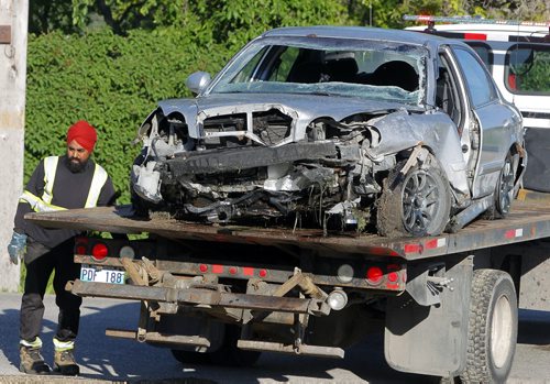 BORIS MINKEVICH / WINNIPEG FREE PRESS MVC into ditch a the end of Grassie Blvd. where it hits Plessis Road.  Aftermath on the tow truck. June 13, 2016.