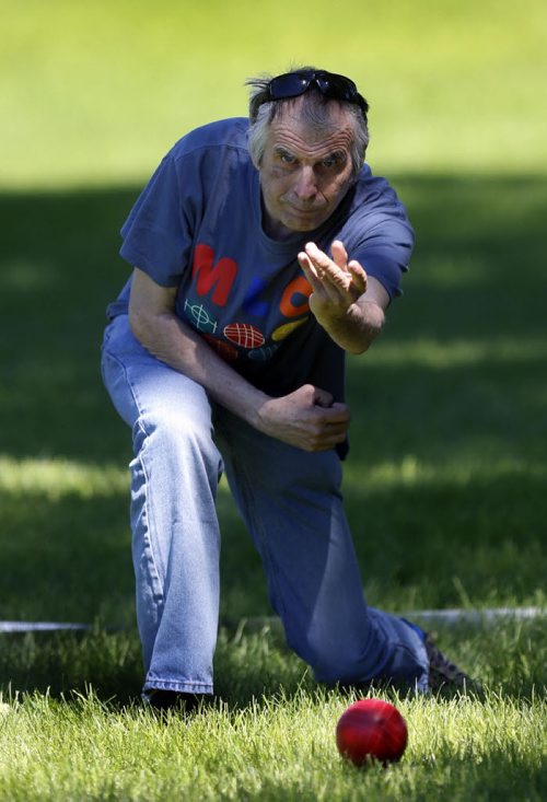 WAYNE GLOWACKI / WINNIPEG FREE PRESS     Special Olympics Manitoba athlete Doug Slobodian tosses a ball during a game of bocce ball on the lawn of the Manitoba Legislative bld. Monday morning. This was part of the events that began earlier with a Law Enforcement Torch Run from City Hall  to the Legislative grounds to kick off Special Olympics 2016 Awareness Week with this year message "Accept With No Exception".    June 13  2016