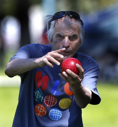 WAYNE GLOWACKI / WINNIPEG FREE PRESS     Special Olympics Manitoba athlete Doug Slobodian takes aim during a game of bocce ball on the lawn of the Manitoba Legislative bld. Monday morning. This was part of the events that began earlier with a Law Enforcement Torch Run from City Hall to the Legislative grounds to kick off Special Olympics 2016 Awareness Week with this year message "Accept With No Exception".    June 13  2016