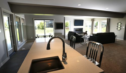 WAYNE GLOWACKI / WINNIPEG FREE PRESS    Homes.   10 Willow Landing in Pritchard Farm Southlands Village. The bar in lower level, with door outside at left. ¤ Irwin Homes rep is Andrew Koop. Todd Lewys story    June 13  2016