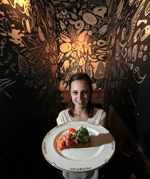 PHIL HOSSACK / WINNIPEG FREE PRESS - Carolina Konrad shows off Smoked Arctic Char one of the highlights of the eccentrically wallpapered entrance to the Clementine Cafe.See Review.  June 13, 2016