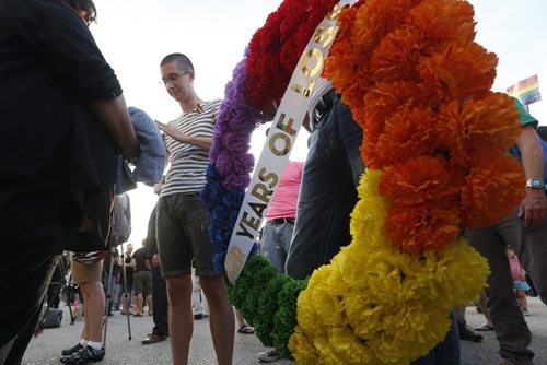 JOHN WOODS / WINNIPEG FREE PRESS People smudge at a vigil for Orlando shooting victims at the Manitoba Legislature Monday, June 13, 2016.