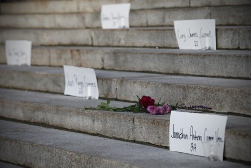 JOHN WOODS / WINNIPEG FREE PRESS Flowers sit beside the names of Orlando shooting victims prior to a vigil for Orlando shooting victims at the Manitoba Legislature Monday, June 13, 2016.