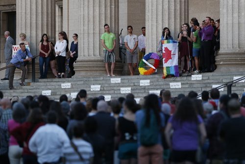 JOHN WOODS / WINNIPEG FREE PRESS People participate in a vigil for Orlando shooting victims at the Manitoba Legislature Monday, June 13, 2016.