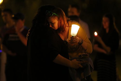 JOHN WOODS / WINNIPEG FREE PRESS People comfort each other at a vigil for Orlando shooting victims at the Manitoba Legislature Monday, June 13, 2016.