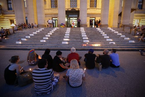 JOHN WOODS / WINNIPEG FREE PRESS People participate in a vigil as the names of the Orlando shooting victims  line the steps of the Manitoba Legislature Monday, June 13, 2016.