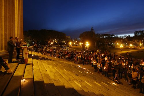 JOHN WOODS / WINNIPEG FREE PRESS People participate in a vigil as the names of the Orlando shooting victims  line the steps of the Manitoba Legislature Monday, June 13, 2016.