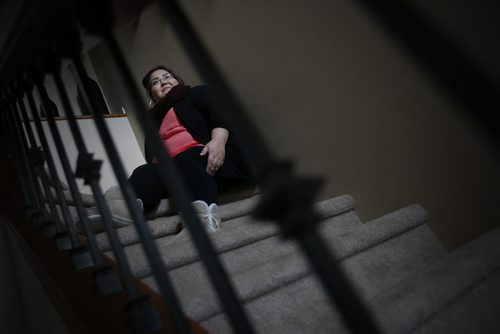 JOHN WOODS / WINNIPEG FREE PRESS Jackie Healey, who was attacked by residents while she was working at a youth group home, is photographed in her home Tuesday, June 14, 2016.