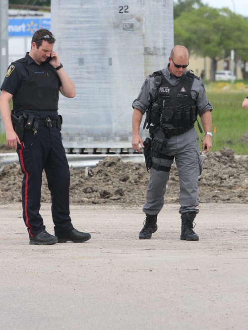 JOE BRYKSA / WINNIPEG FREE PRESSPolice investigate possible firearm discharge in parking lot east of Sobeys on Taylor Tuesday, June 15, 2016   -(See story)