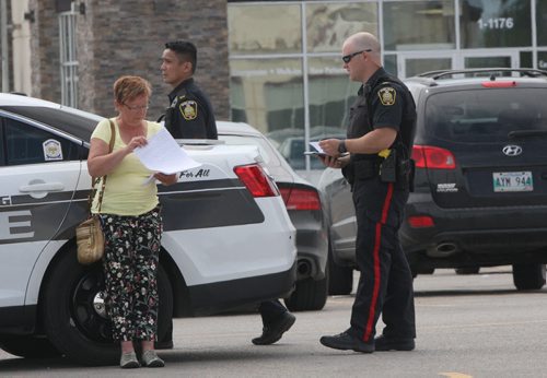 JOE BRYKSA / WINNIPEG FREE PRESSPolice investigate possible firearm discharge in parking lot east of Sobeys on Taylor Tuesday, They interview shoppers who seen incident-June 15, 2016   -(See story)