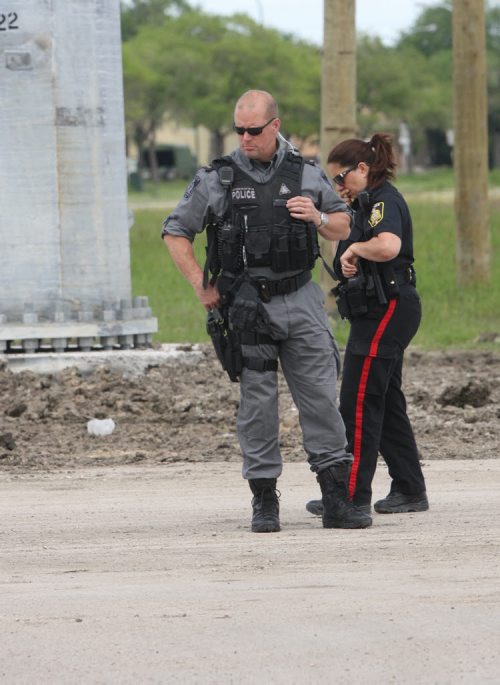 JOE BRYKSA / WINNIPEG FREE PRESSPolice investigate possible firearm discharge in parking lot east of Sobeys on Taylor Tuesday, June 15, 2016   -(See story)