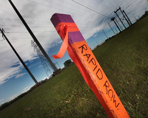 PHIL HOSSACK / WINNIPEG FREE PRESS -   Rapid R.ow O.f W.ay or just row!  Orange stages with purple bands mark the Transit right of way south of the CN main railway and north of Bishop Grandin Bvld. See story. June 15, 2016