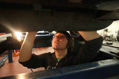 RUTH BONNEVILLE / WINNIPEG FREE PRESS 2017 Project: Grade 11 student Garrett, examines the undercarriage of a vehicle that needs repair work in his Power Mechanics class at Glen Lawn School. Garrett is one of a group of students from Windsor School that the Free Press has been following since kindergarden. See Doug Speirs story. June 15 / 2016