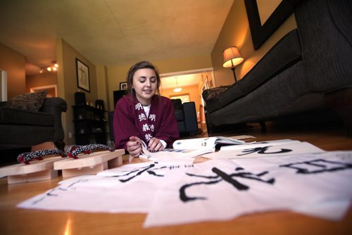 RUTH BONNEVILLE / WINNIPEG FREE PRESS  2017 Project: Grade 11, Glen Lawn student Aby, recalls her time spent in Japan on a school exchange program earlier this year. She shares her stories on learning calligraphy, japanese and how to make wooden shoes while wearing her school uniform at her home in St. Vital.  Aby is one of a group of students from Windsor School that the Free Press has been following since kindergarden.    See Doug Speirs story.   June 15 / 2016