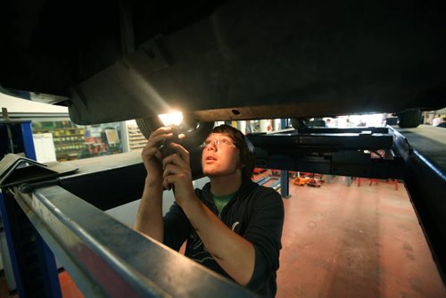 RUTH BONNEVILLE / WINNIPEG FREE PRESS  2017 Project: Grade 11 student Garrett, examines the undercarriage of a vehicle that needs repair work in his Power Mechanics class at Glen Lawn School.   Garrett is one of a group of students from Windsor School that the Free Press has been following since kindergarden.    See Doug Speirs story.    June 15 / 2016