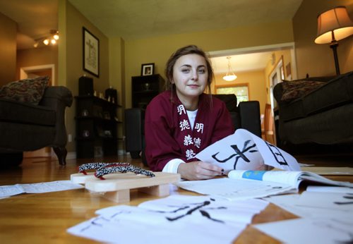 RUTH BONNEVILLE / WINNIPEG FREE PRESS  2017 Project: Grade 11, Glen Lawn student Aby, recalls her time spent in Japan on a school exchange program earlier this year. She shares her stories on learning calligraphy, japanese and how to make wooden shoes while wearing her school uniform at her home in St. Vital.  Aby is one of a group of students from Windsor School that the Free Press has been following since kindergarden.    See Doug Speirs story.   June 15 / 2016