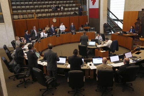 WAYNE GLOWACKI / WINNIPEG FREE PRESS  Winnipeg Council members stand in favour to accept the Manitoba Hydro land deal at City Hall Wednesday afternoon. Aldo Santin story    June 15  2016