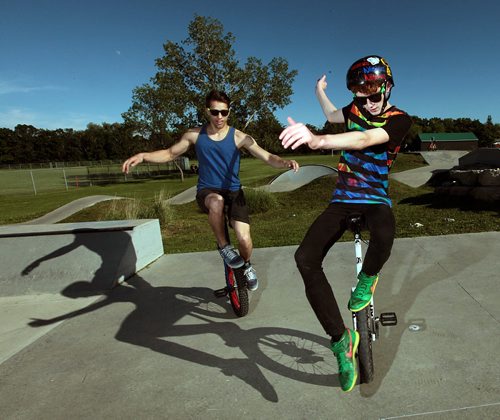 PHIL HOSSACK / WINNIPEG FREE PRESS -   Unicyclists Ruel Neuman (left) Jand Louis Stevens strike a pose for Dave Sanderson's story. June 15, 2016