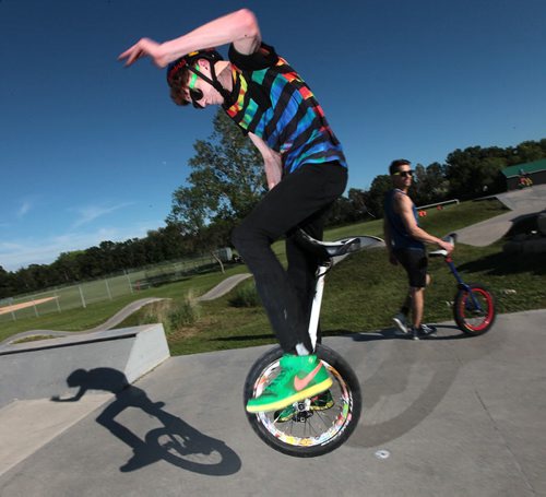 PHIL HOSSACK / WINNIPEG FREE PRESS -   Unicyclist Louis Stevens struts his stuff beside Ruel Neuman (right) for Dave Sanderson's story. June 15, 2016