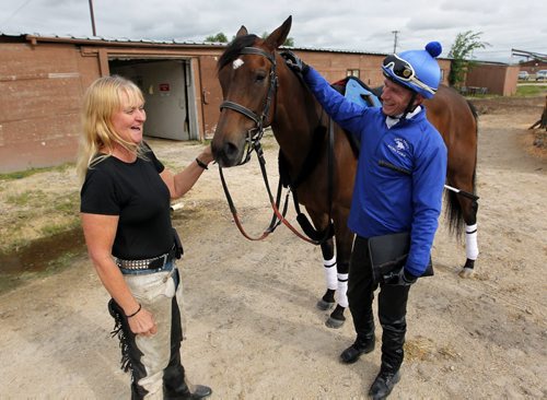 BORIS MINKEVICH / WINNIPEG FREE PRESS (Left) Trainer Penny Hulme and horse Sugah Sweet. Small trainer won with big longshot, amazing performance, set off huge win 4 payoff.Photo taken at Assiniboia Downs barns. (right) Tyler Walker was the jockey that rode the horse to victory. June 16, 2016.