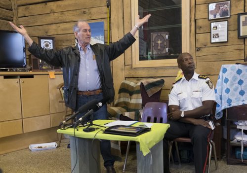 ZACHARY PRONG / WINNIPEG FREE PRESS  Sel Burrows, left, the chair of the North Point Douglas Residents Committee gives a speech at the Barber House in North Point Douglas during an event honouring outgoing Winnipeg Chief of Police Devon Clunis, right, on June 16, 2016.