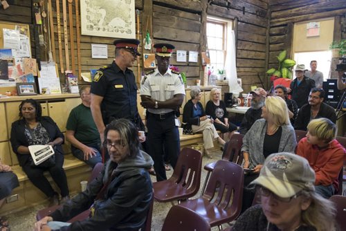 ZACHARY PRONG / WINNIPEG FREE PRESS  Outgoing Winnipeg Chief of Police Devon Clunis, wearing a white uniform, at an event at the Barber House in North Point Douglas during an event honouring his retirement and commitment to inner city communities  on June 16, 2016.