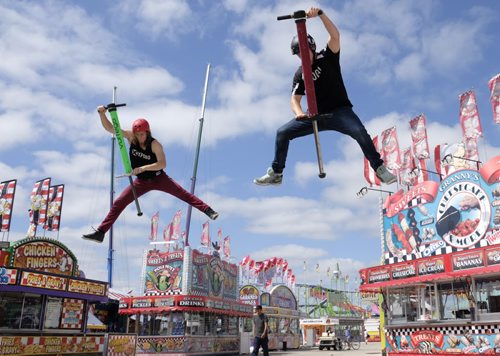 ZACHARY PRONG /  WINNIPEG FREE PRESS  Daniel Mahoney, left, and Harry White, Xpoogo athletes, practice their moves at the Red River Ex before opening day. They will be performing at the Red River Ex which runs from June 17 to June 26, 2016.