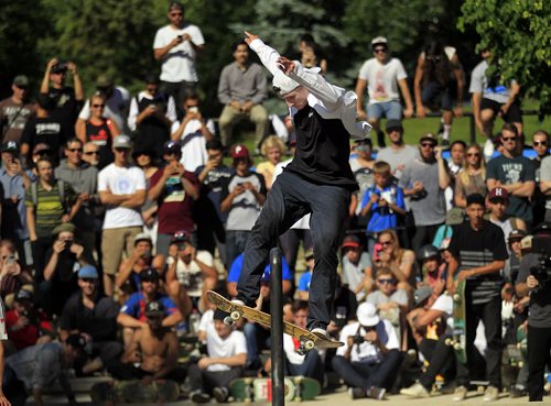 PHIL HOSSACK / WINNIPEG FREE PRESS - SK8 - Australian boarder Shane O'Neill leaps up and rides a rail in front of a standing room only crowd at the Forks Skate Park Friday afternoon as part of the Primitive Canadian National Skate Tour  Make Canada Great Again. See release. STAND-UP  June 17, 2016