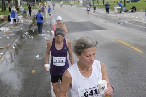 ZACHARY PRONG /  WINNIPEG FREE PRESS  Runners in the Manitoba Marathon break for water on June 19, 2016.