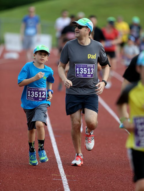 TREVOR HAGAN / WINNIPEG FREE PRESS Manitoba Marathon participants Max Gillman (the kid) and Mark Gillman at the University of Manitoba, Sunday, June 19, 2016.