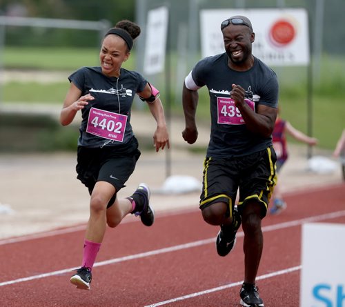 TREVOR HAGAN / WINNIPEG FREE PRESS 2016 Manitoba Marathon Free Press 10k participants Kyana Wonnacott and Oneil Whiterace to the finish line at the University of Manitoba, Sunday, June 19, 2016.