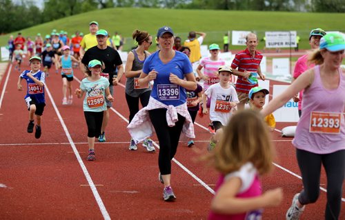 TREVOR HAGAN / WINNIPEG FREE PRESS 2016 Manitoba Marathon Super Run participants arrive to the finish line at the University of Manitoba, Sunday, June 19, 2016.