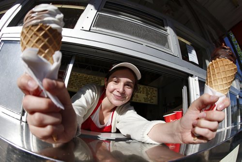 JOHN WOODS / WINNIPEG FREE PRESS Twist and vanilla with chocolate dip cones are served up by Micaela Stokes at the Bridge Drive-In Monday, June 20, 2016.