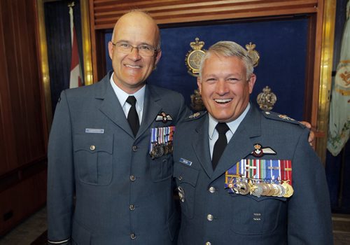 BORIS MINKEVICH / WINNIPEG FREE PRESS (left) Colonel Steve Charpentier, Director of Flight Safety is the officer who inspired MGen C.H.J. Drouin, right, early in his career. Major-General Christian Drouin assumed command of 1 Canadian Air Division (1 CAD) from Major-General David Wheeler in Winnipeg at 17 Wing. Lieutenant-General Michael Hood, Commander of the Royal Canadian Air Force presided over the ceremony. June 20, 2016.