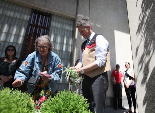 RUTH BONNEVILLE / WINNIPEG FREE PRESS  Mayor Brian Bowman takes part in Celebrating National  Aboriginal Day with formal speeches, Traditional Metis Dancing and planting cedar trees and sage plants with spiritual teacher, Carolyn Moar Tuesday.  This year had a   special honour being 2016 Year of Reconciliation.  Mayor Bowman and Moar plant sage in pots outside City Hall.    June 21 / 2016