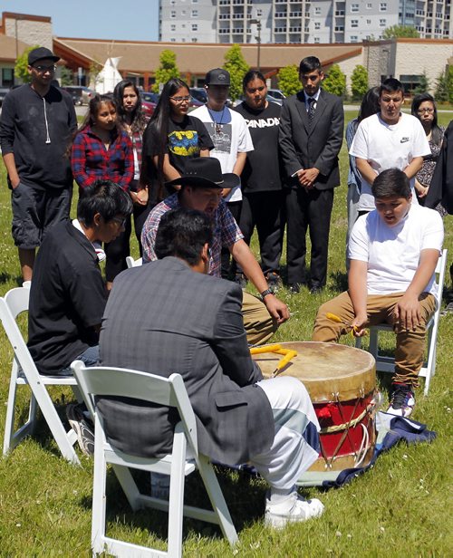 BORIS MINKEVICH / WINNIPEG FREE PRESS Drummers at the ceremony for the official ground breaking of the new Southeast Collegiate school that is going to be built on the Lee Blvd location.  In behind is the graduating class of 2016 from Southeast Collegiate. June 21, 2016.